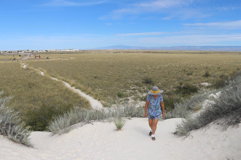 Vicki climbing the barrier dune on the Dune Life Nature Trail on a hot day in White Sands National Park