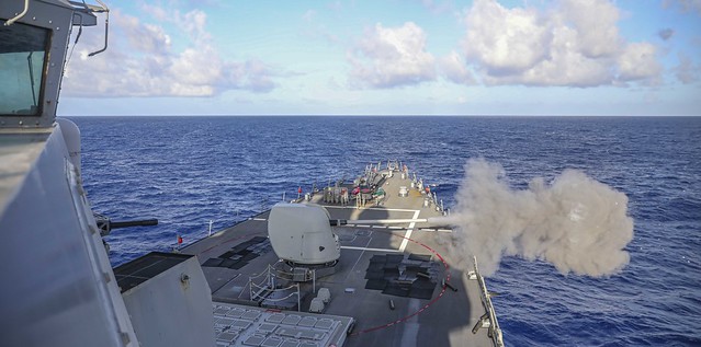 USS Higgins (DDG 76) conducts a live-fire exercise in the Philippine Sea.