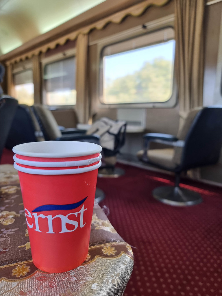 A close-up of a red cup of coffee in the restaurant on board