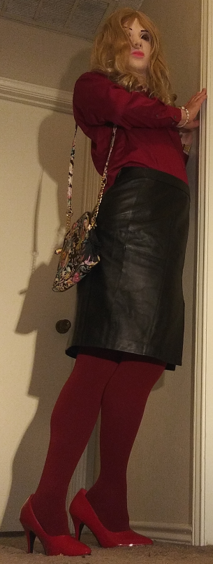 Red button down with black leather skirt and red pantyhose