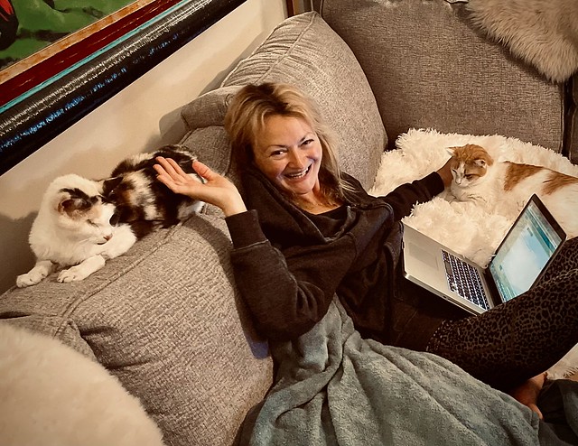 Iwona on couch with companions
