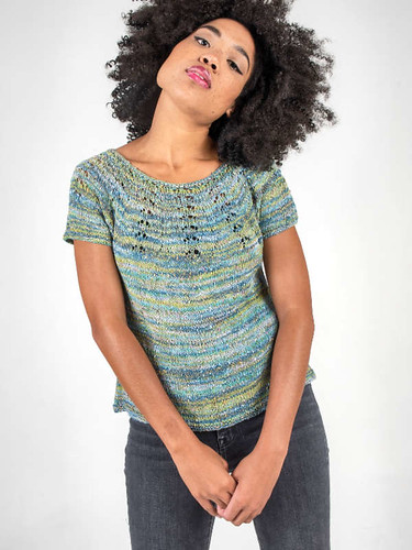 Etta by Alison Green for Berroco and knit using Berroco Summer Sesame is a top down circular yoke summer top with a subtle lace pattern.