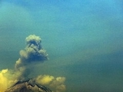 smoke erupting from the Popo Volcano in Cholula, Mexico