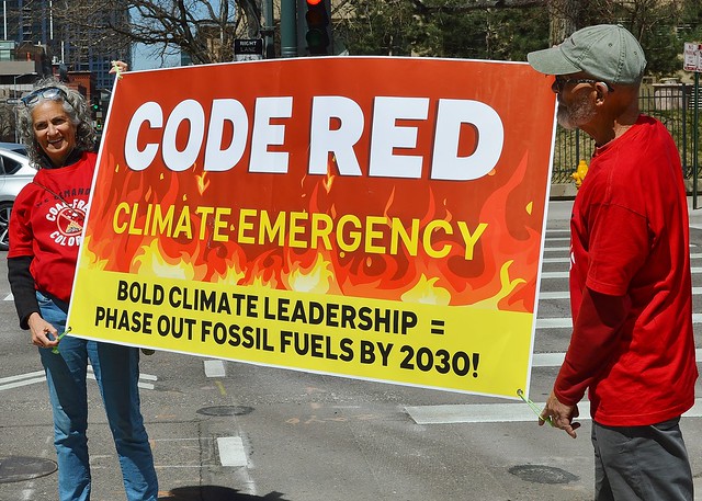 Dealing with the climate emergency by phasing out fossil fuels was a demand of protesters outside Xcel Energy's Denver office.