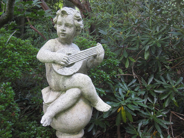 A Stone Cherub Playing the Mandolin - the Forest Glade Gardens; Mount Macedon Road, Mount Macedon