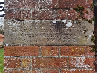 Erected by the parishioners in honour of the Coronation of King Edward VII and Queen Alexandra August 9th 1902