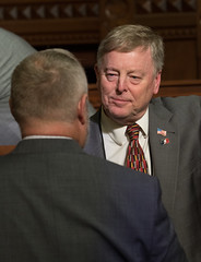 State Rep. Mike France speaks with a colleague on the House floor during a recent session day.