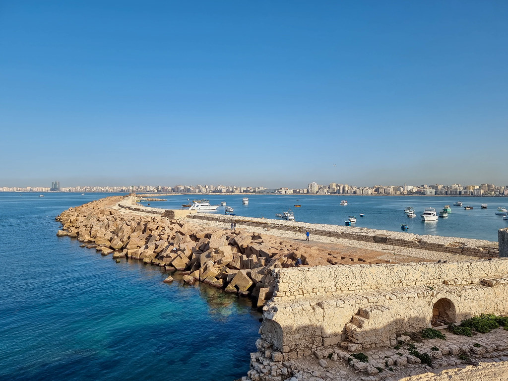 A panoramic view of Alexandria taken from the walls of the fort. You can notice the site of the Library of Alexandria, as well as the promenade that borders the city from the sea.