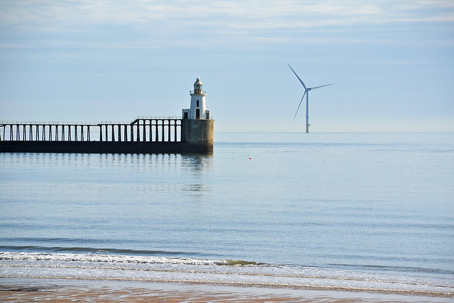 Blyth lighthouse and wind turbine on a calm morning