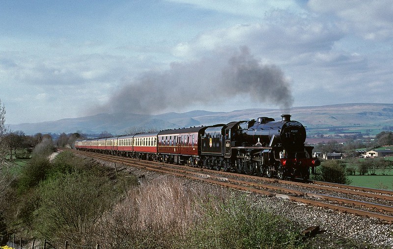 45407,running as classmate 45157,passes the caravan site with the S+C 125 Anniversary Express on 1/5/2001.
Additional static caravans and lineside growth soon limited options at this once popular location
Copyright David Price
No unauthorised use