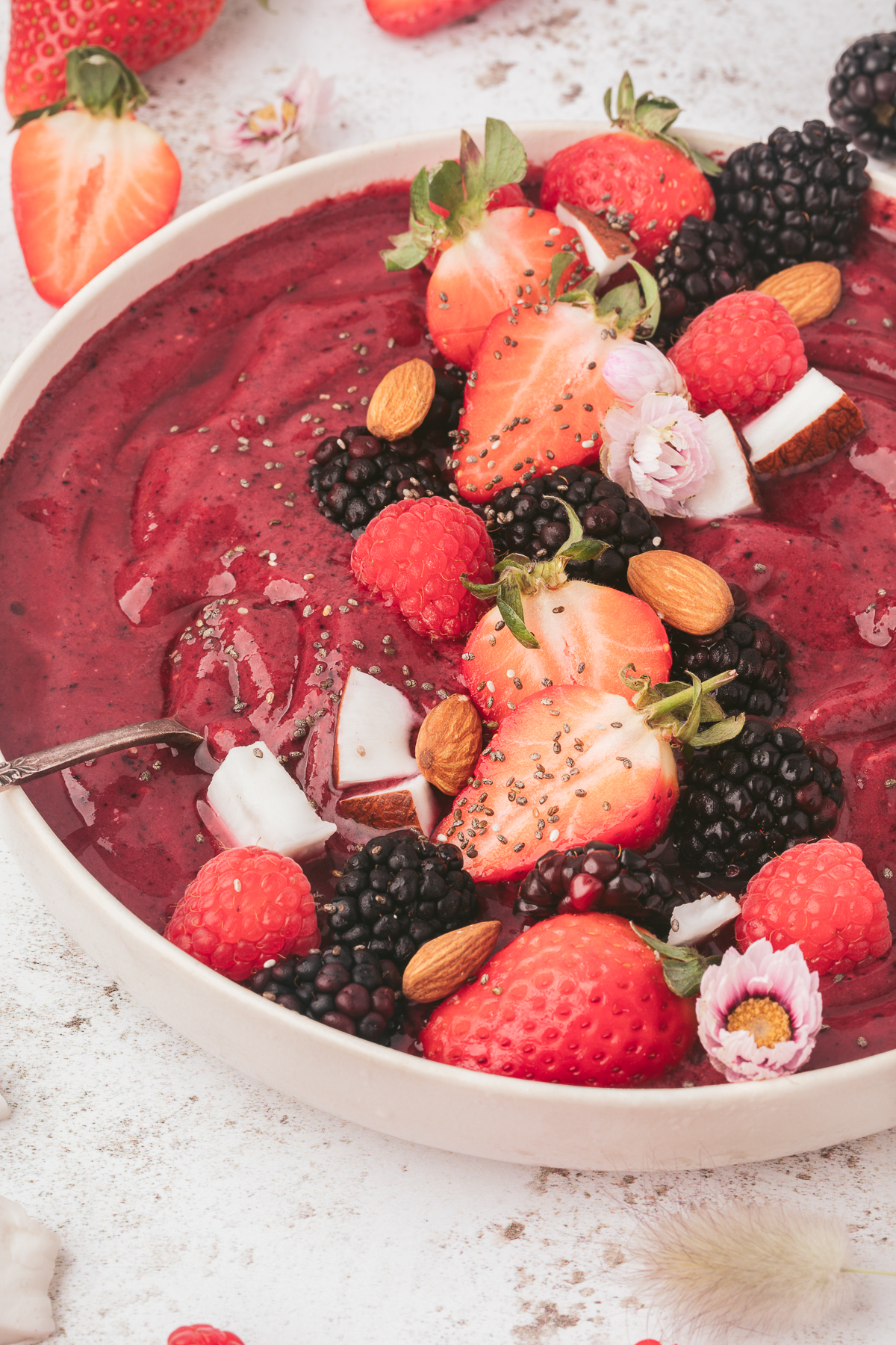 Berry Smoothie Bowl topped with fresh berries, coconut, almonds, and chia seeds