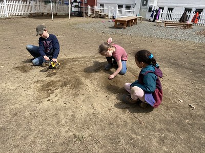 playing with the dirt on the hill