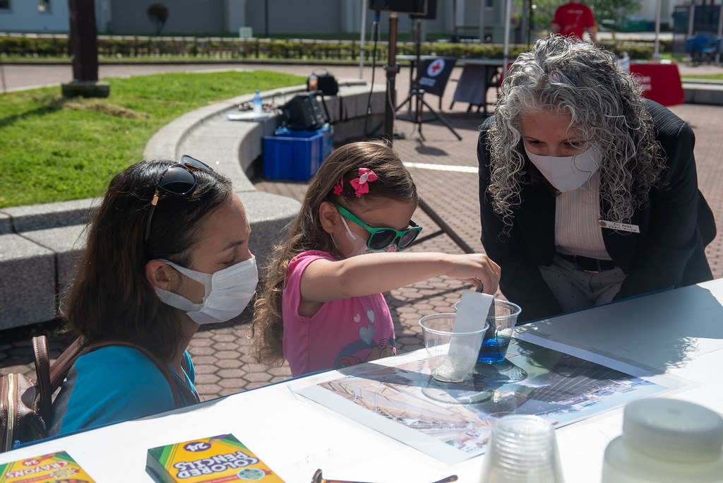 Children learn science at the Fleet Activities Yokosuka 2022 Earth Day Fair.