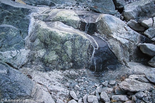 Water-stained rocks below Willow Falls, Death Valley National Park, California