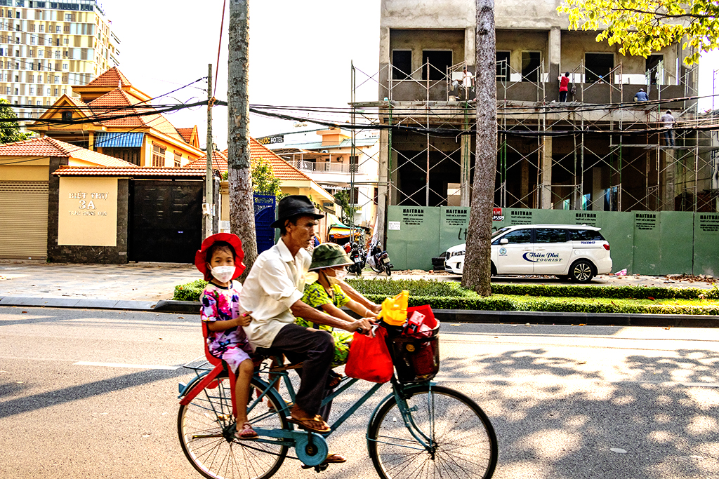 Old man and two children on bicycle on 4-27-22--Vung Tau copy
