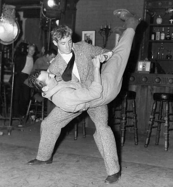 1946. Guy Madison on the set of ''Till the End of Time'' practices jitterbug with dance coach.