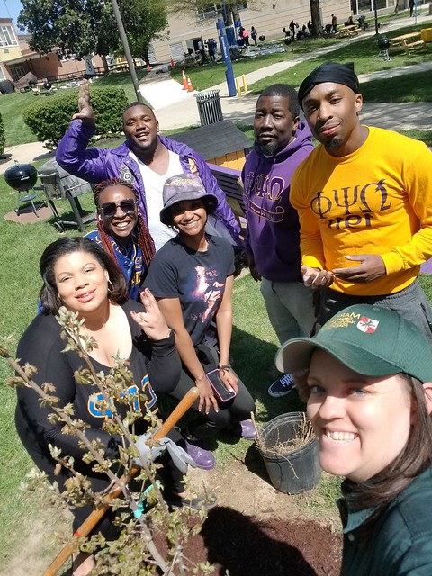 Photo of group of people with a tree they planted