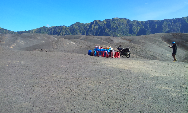 Strategic location for a pop up cafe, alone in the middle of sand dunes, Mount Bromo, Indonesia.