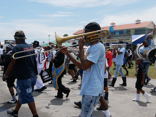 Big 6 Brass Band parades with YMO at Jazz Fest on May 1, 2022. Photo by Louis Crispino.