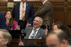 State Rep. Bill Pizzuto reacts to a colleague during a brief break during a debate in the House of Representatives.
