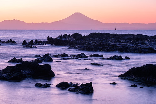 Mt Fuji during a pink sunset by Deseree Joy, Mount Fuji taken from the shore in Kanagawa, Japan during sunset.rock sunset water fujifilmxt2 mtfuj