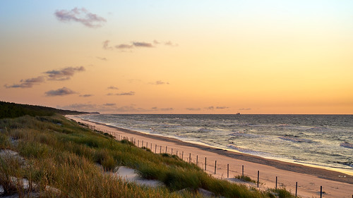 poland beach sea baltic sunset goldenhour gold golden hour water sand sandy grass waves sky calm evening