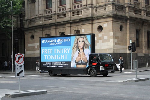 Mobile billboard for Spearmint Rhino strip club cruising Melbourne's legal district