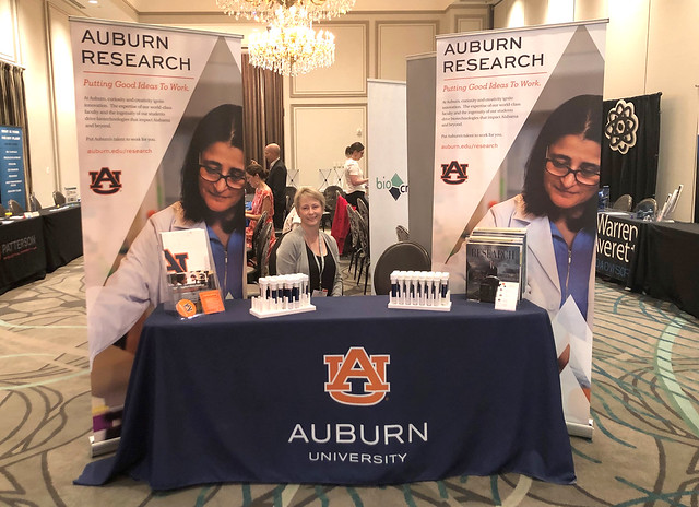 Liz Smith works at Auburn’s booth during the BIO Alabama conference.
