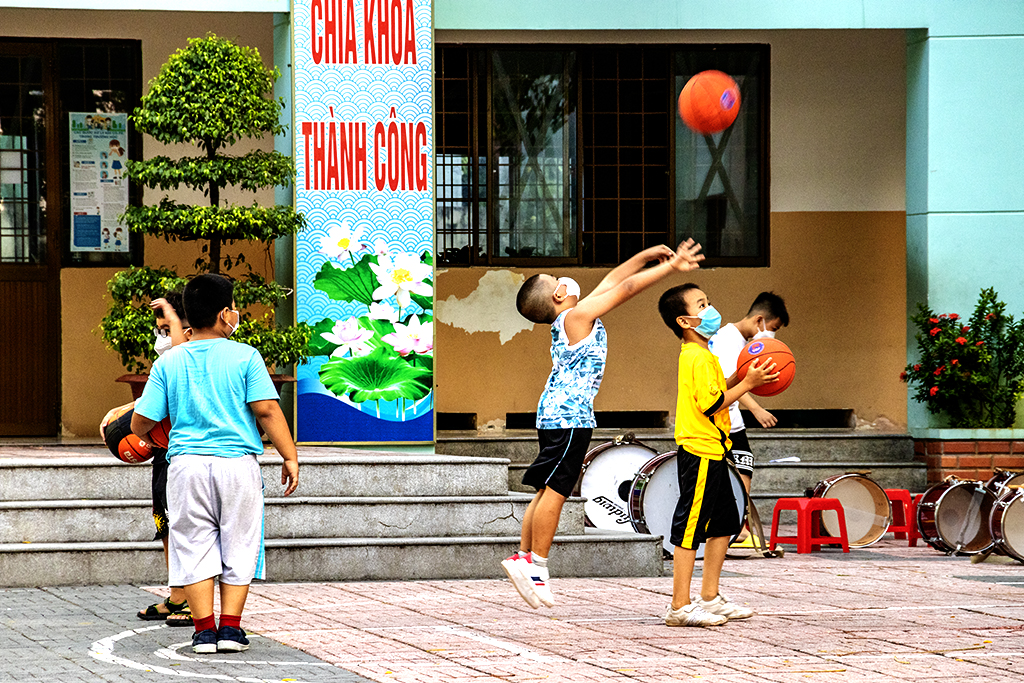 Masked boys playing basketball on 5-6-22--Vung Tau copy