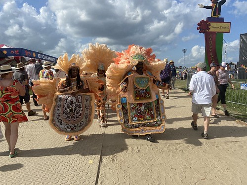 Cheyenne Black Masking Indians make their way through the crowd at Jazz Fest on May 5, 2022. Photo by Carrie Booher.