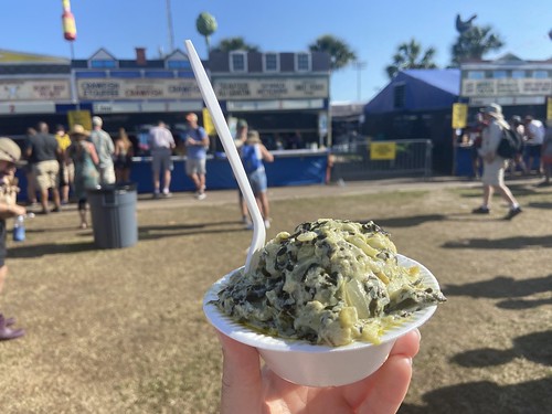 Spinach & artichoke casserole at Jazz Fest on May 6, 2022. Photo by Carrie Booher.