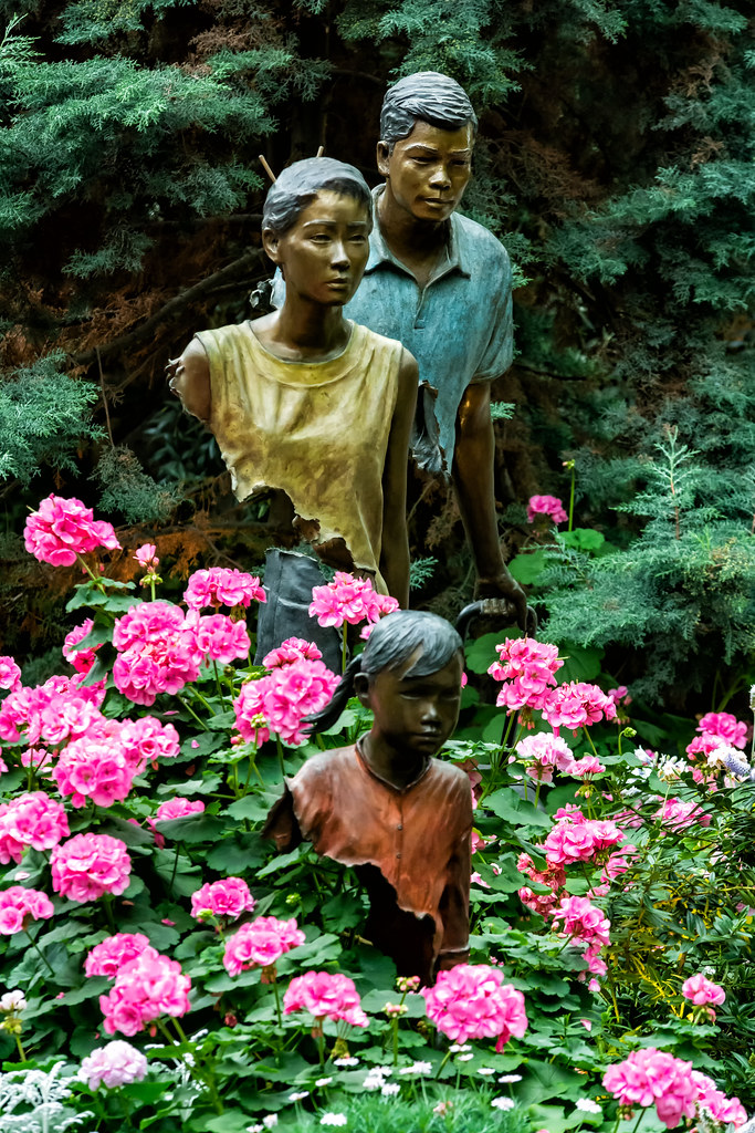 Heranium flowers and Travel sculpture
