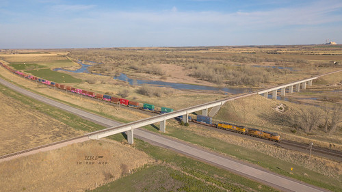 "Long Views....Long Trains", up drone dronephotography intermodal stack train bridge nebraska ge tracks trains railroads railroadphotography railfanning railroad