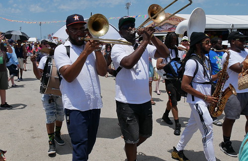 Da Souljas Brass Band with Men Buckjumpers at Jazz Fest.  Photo by Louis Crispino.