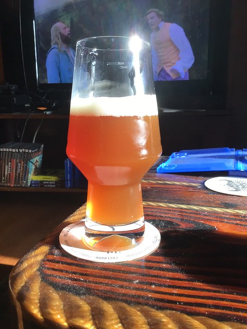 Amber ale in glass on table