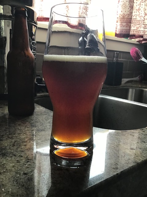 Strong amber ale in glass in kitchen