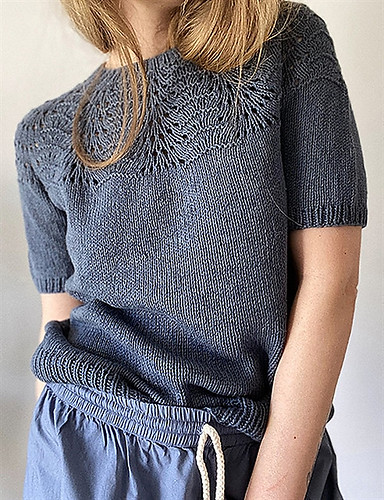 The Peacock Tee by Lene Holme Samsoe is worked top down with a lace pattern on the yoke.