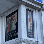 Mon, 2022-05-16 12:30 - During the 1920s, as W H Smith's continued to develop a strong house style, they commissioned Carter's of Poole, the well knwon tile and faience manufacturers, to produce a series of pictorial advertising panels that adorned a number of shop facades and fascias. As can be imagined, over time, many of these have been lost in-situ due to closures, demolitions and refitting of shops. Some however survive and at the Tenby, Wales, store four of these splendidly hand painted tile sets survive - two either side of the entrance.

They are very 'Carter's' in style and colour. The 'Colour Books' is the most free-hand, the 'Sports Books' most contemporary in terms of fashion and the 'Road Maps' a wonderful example of the pottery's lilac/blue glazes.