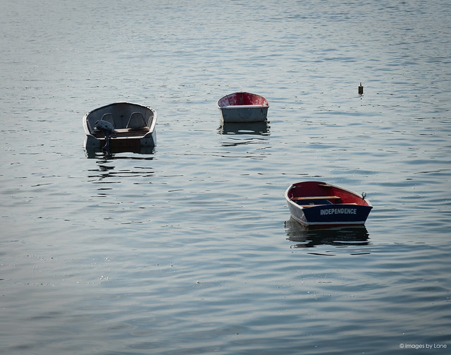 trio of boats in harbor