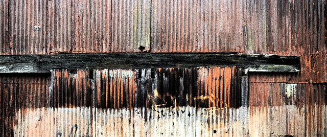 rusty weathered corrugated metal building on Granville Island, Vancouver