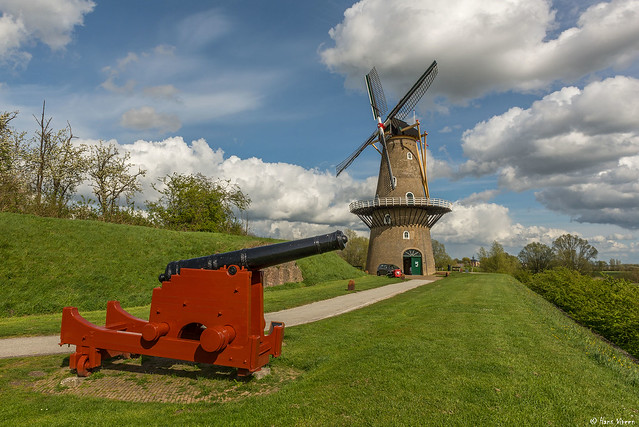 Big canon in front of traditional windmill 'The Hope' in Gorinchem, the Netherlands.