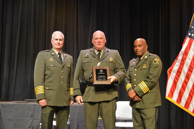 Photo of officers on a stage