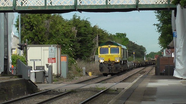 66 528 approaches Trimley Station with an intermodal train in tow.