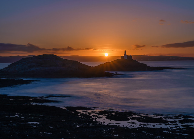 Mumbles Lighthouse during sunrise