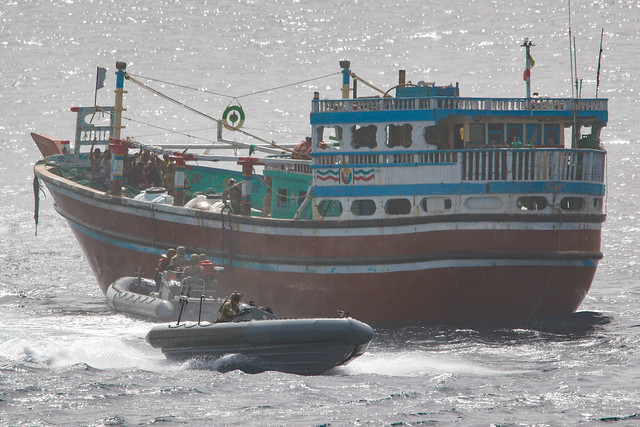 An interdiction team from USS Momsen (DDG 92) boards a fishing vessel in the Gulf of Oman.