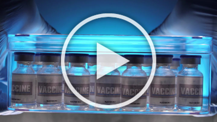 A row of vaccine bottles on a production line