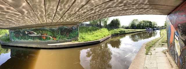 The Leeds & Liverpool canal from under the road bridge at Heatons Bridge