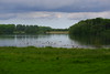 View of the lake from the cemetery of St. Petri Church in Bosau | May 22, 2022 | Bosau - district of Ostholstein - Schleswig-Holstein - Germany
