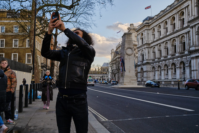 Photographing in a leather jacket - Parliament Street, London