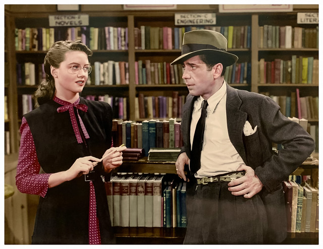 Dorothy Malone (as a bookstore proprietor) and Humphrey Bogart (as Philip Marlowe) in “The Big Sleep” (Warner Bros., 1946).